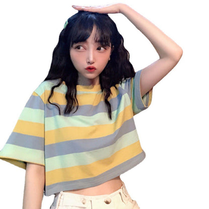 Woman wearing Loose Rainbow Striped Crop Top in a sunny park