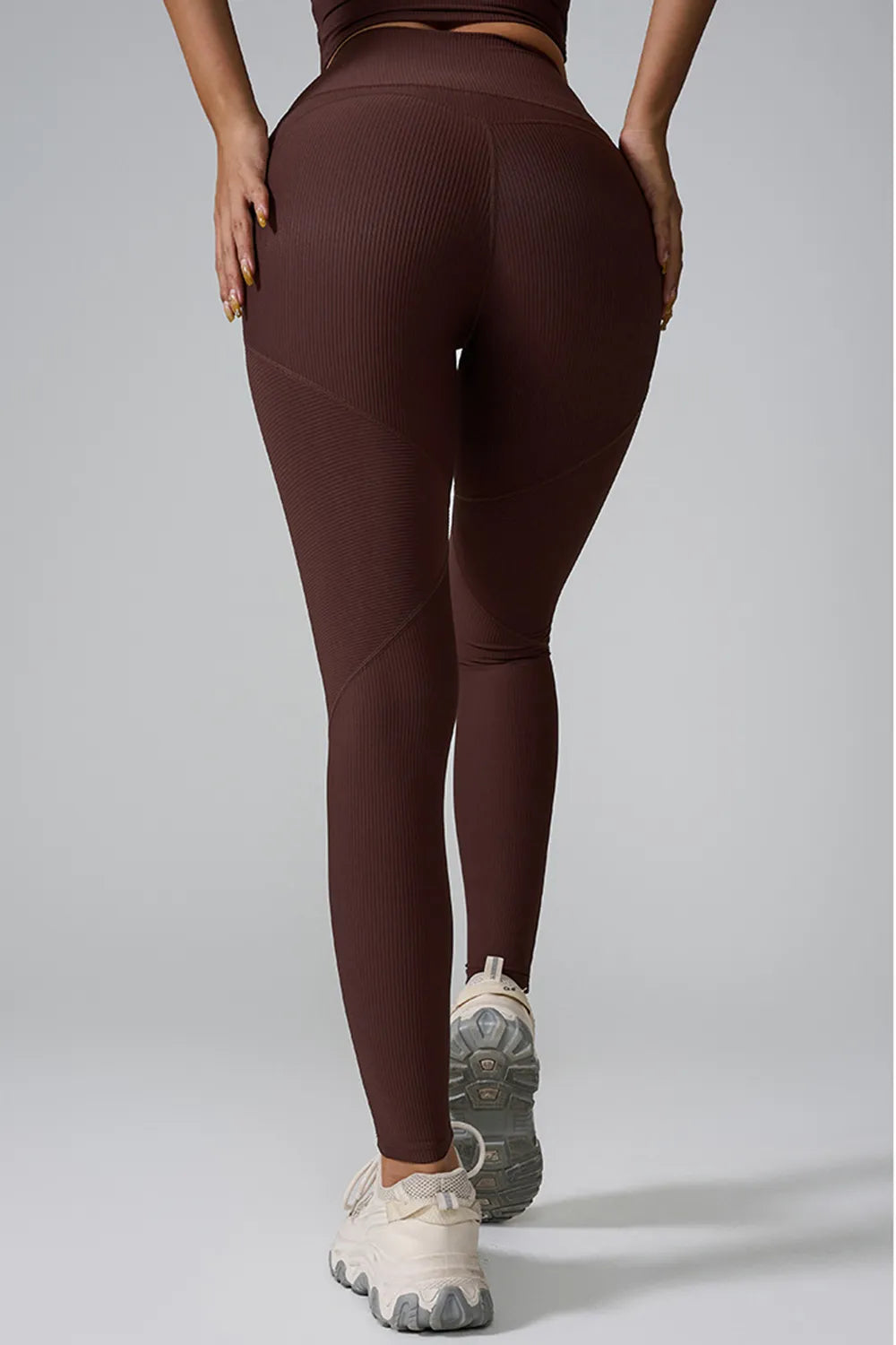 Woman wearing High Waist Active Leggings in a gym setting