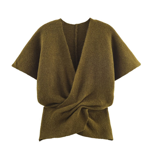 Woman wearing V-Neck Open Front Pleated Sweater in a cozy setting