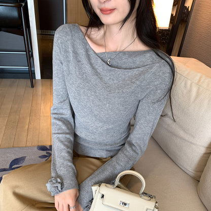 Woman wearing Boat Neck Long Sleeve Slim Fit Knit Top in a stylish setting