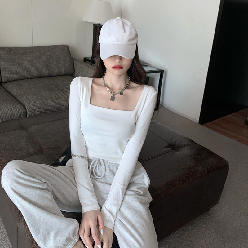 Woman wearing Slim Fit Round Neck Long Sleeve Basic T-Shirt in a casual setting