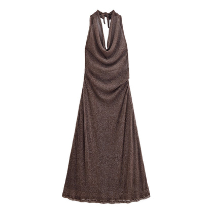 Woman wearing French Backless Metallic Dress in an elegant setting