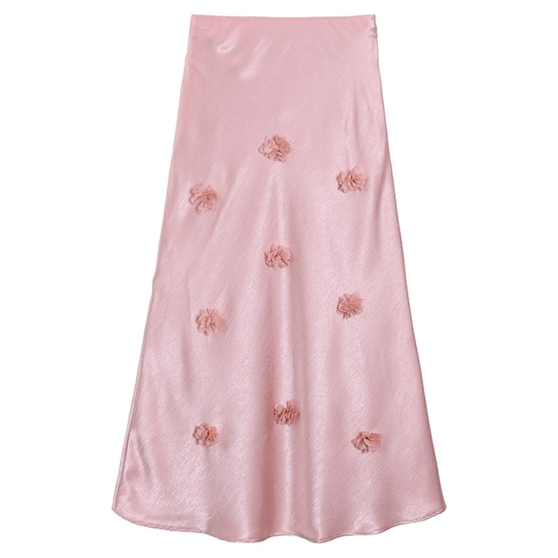 Woman wearing 3D floral skirt in a garden setting