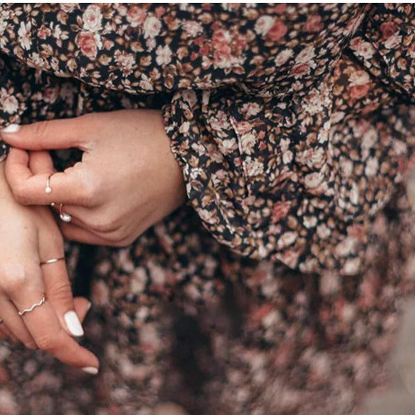 Woman wearing Floral Print Ruffle Sleeve Midi Dress in a garden setting