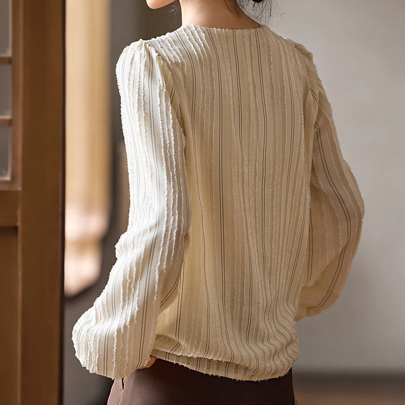 Woman wearing Elegant Textured Collar Shirt in urban setting