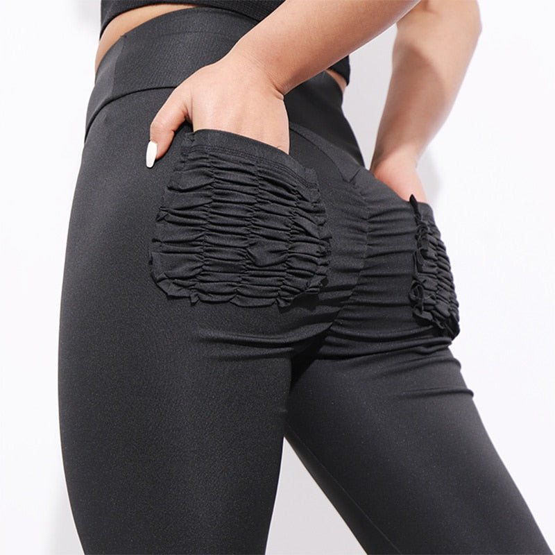 Woman wearing High Waist Push Up Fitness Leggings in a gym setting