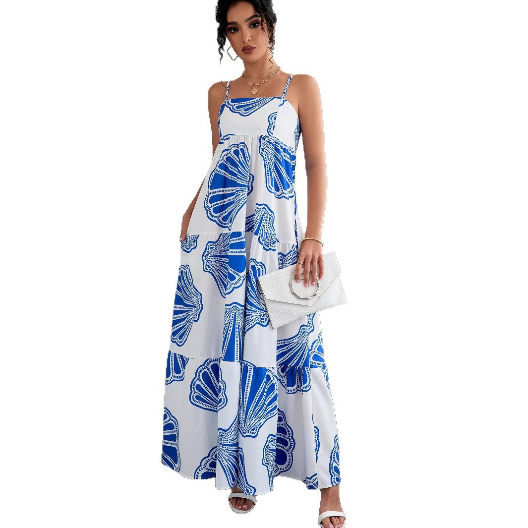 Woman wearing Printed Sleeveless Layered Maxi Dress in a sunny beach setting