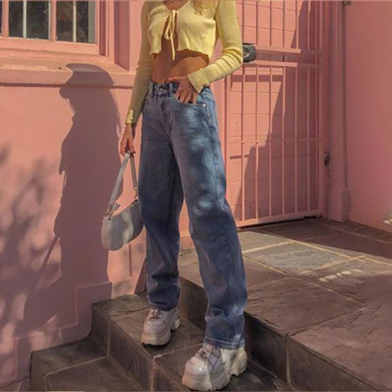 Woman wearing wide leg jeans in a casual outdoor setting
