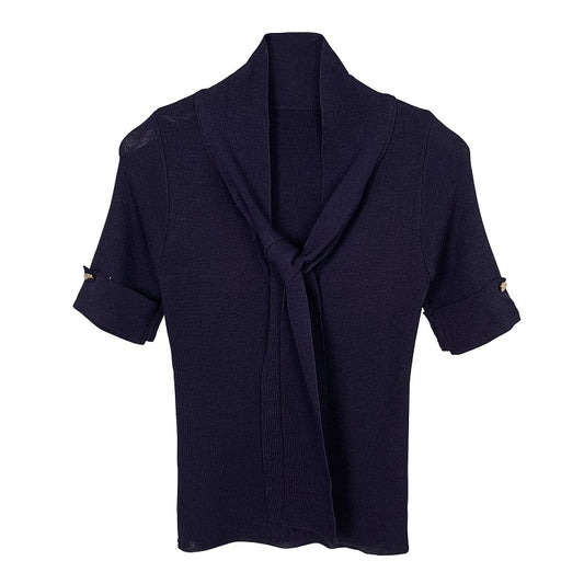 Woman wearing Solid V-Neck Slim Fit Top in a casual setting