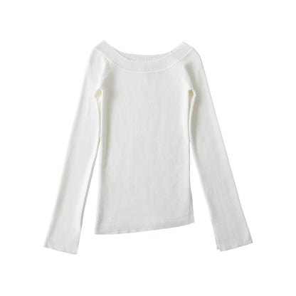Woman wearing One Shoulder Slit Slanted Hem Top in a stylish setting