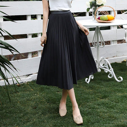 Woman wearing Solid Pleated Skirt in a casual outdoor setting