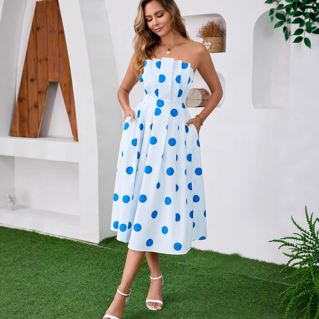 Woman wearing Polka Dot One-Shoulder Midi Dress in a summer setting