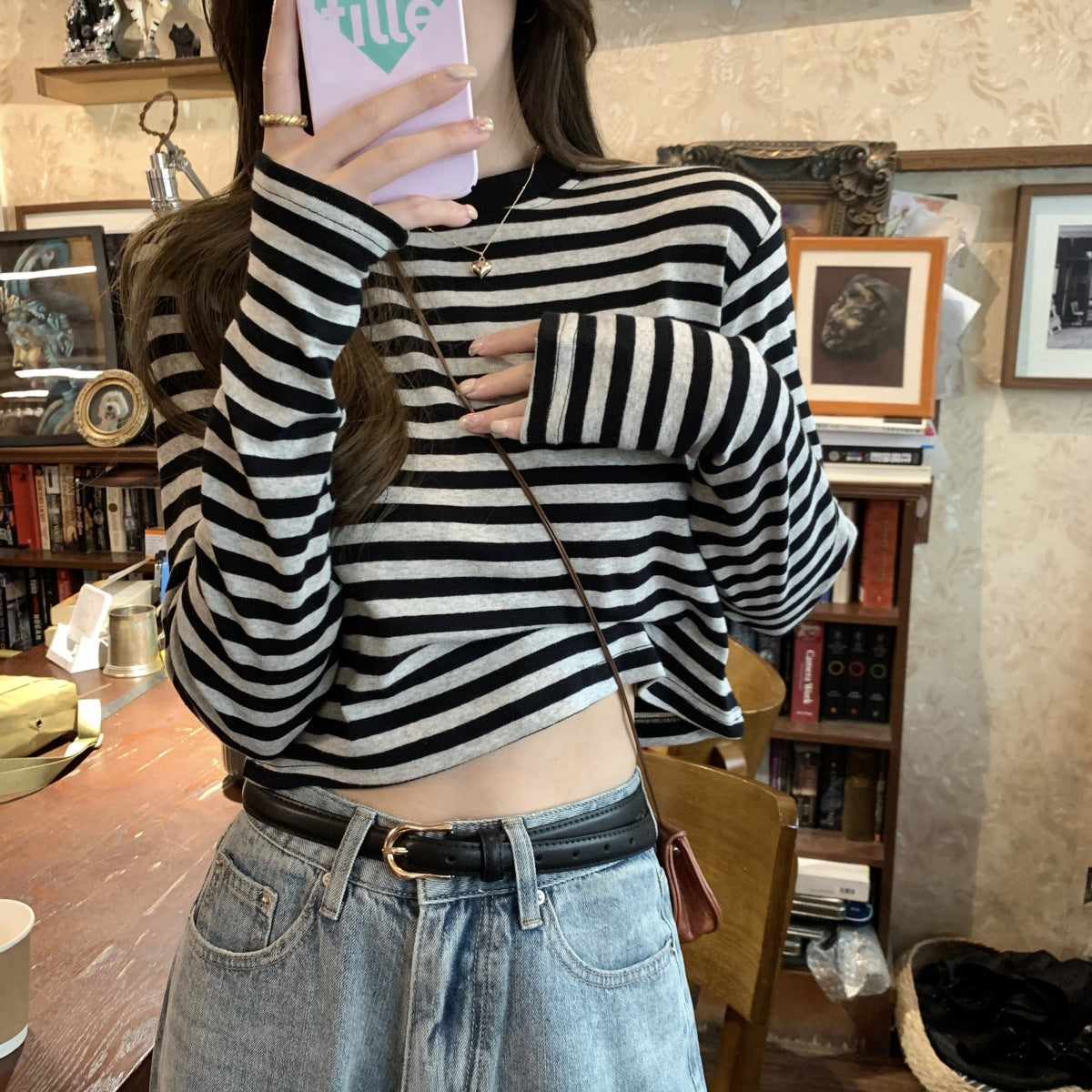 Woman wearing Stripe Long Sleeve Crop Top in a casual setting