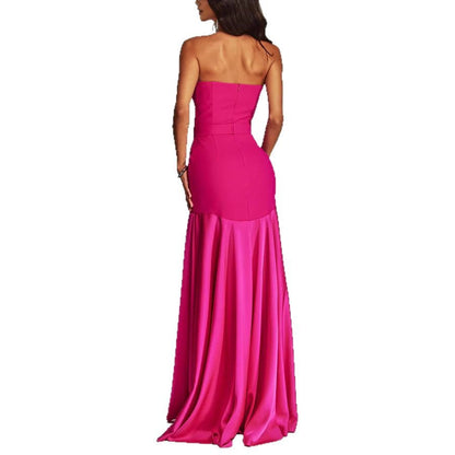 Woman wearing sleeveless long dress in a sunny outdoor setting