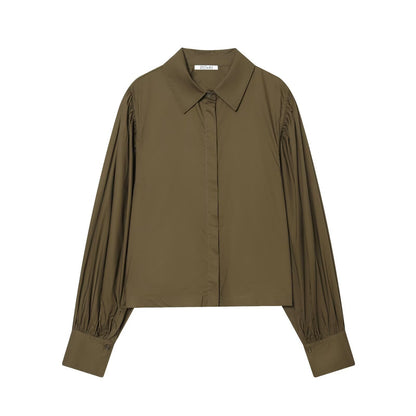 Woman wearing Bubble Sleeve Poplin Shirt in a casual setting