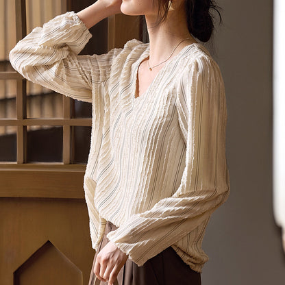 Woman wearing Elegant Textured Collar Shirt in urban setting