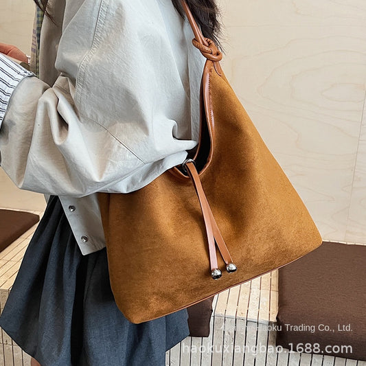 Women's Large Capacity Matte Retro PU Leather Drawstring Shoulder Tote Bag – Front View | TajStylo