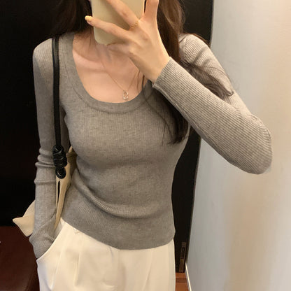 Woman wearing U Neck Long Sleeve Pullover Top in a casual setting