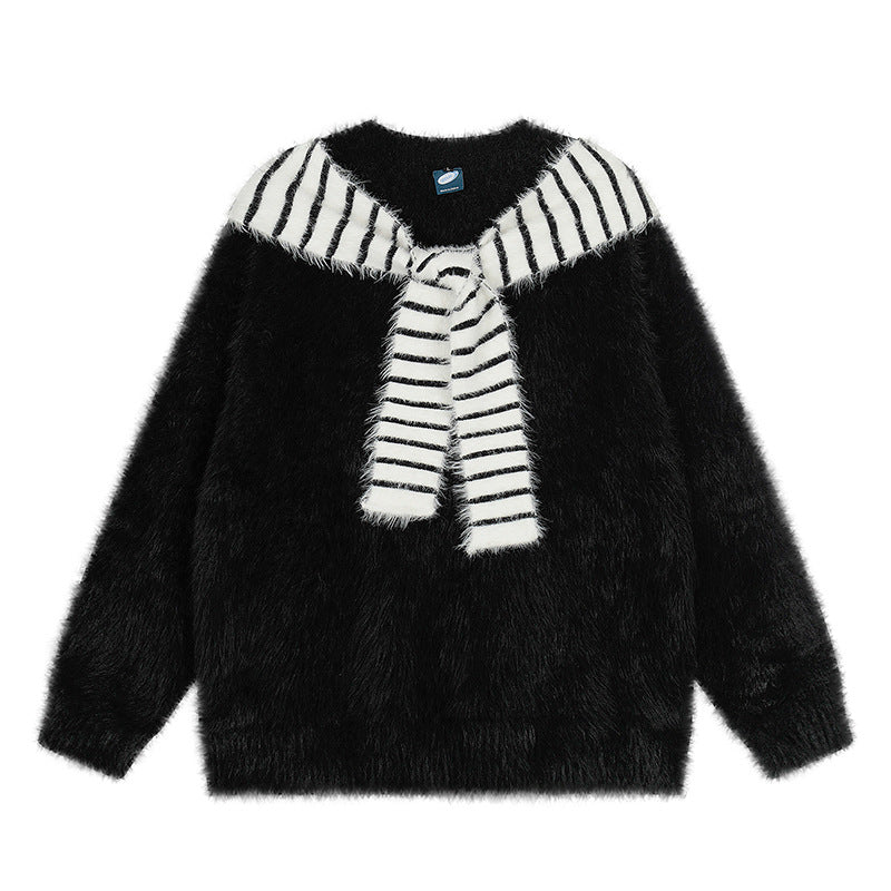 Woman wearing Oversized Loose Fit Poncho Knit Sweater in a cozy indoor setting