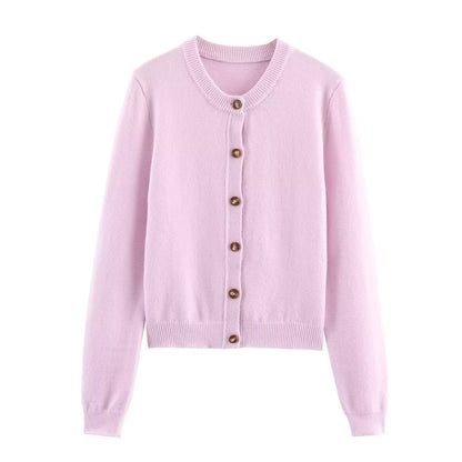 Woman wearing Round Neck Long Sleeved Knitted Cardigan Jacket in a stylish setting