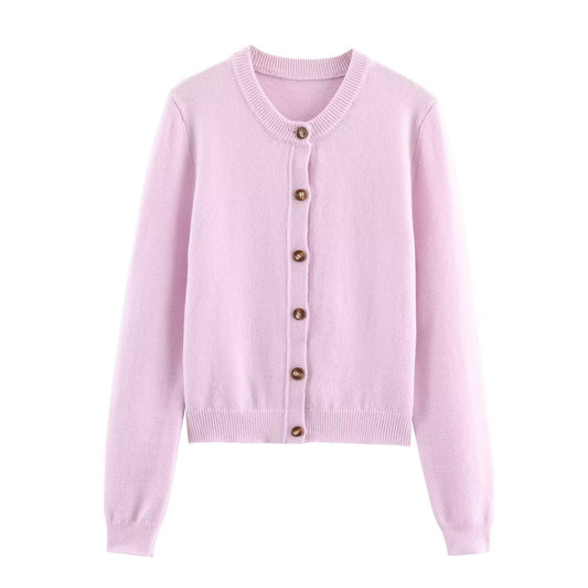 Woman wearing Round Neck Long Sleeved Knitted Cardigan Jacket in a stylish setting
