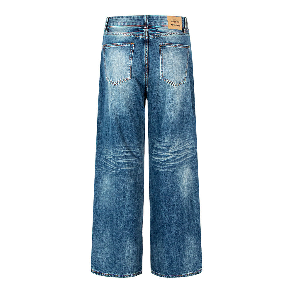 Woman wearing Vintage Washed Distressed Wide Leg Jeans in an urban setting