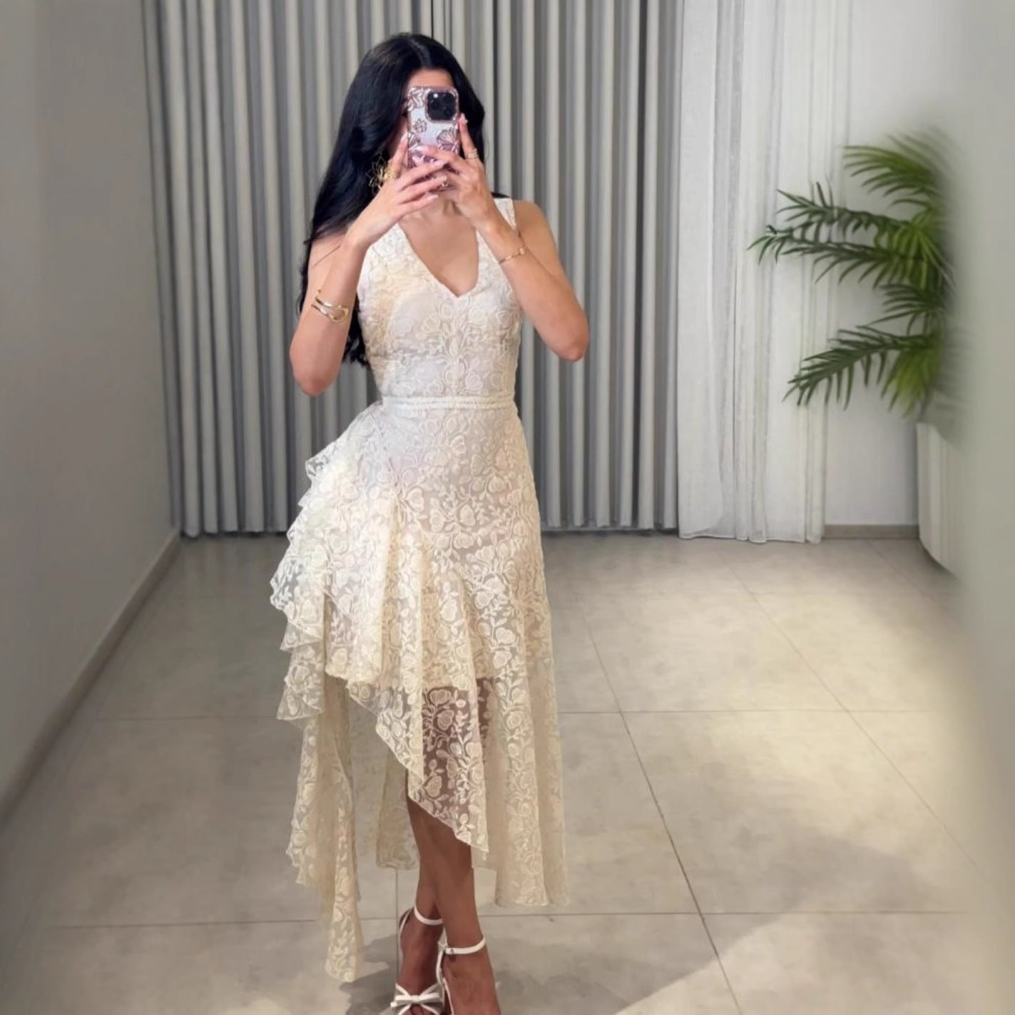Woman wearing Asymmetric Jacquard Dress in an elegant setting