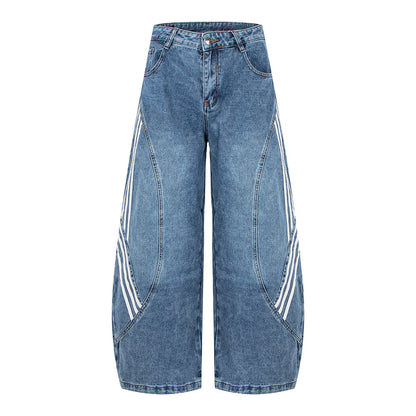 Woman wearing Retro Street Washed Three-Stripe Deconstructed Wide-Leg Jeans in a casual city setting