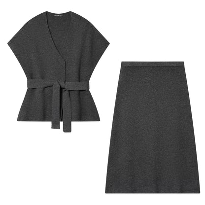 Woman wearing Belted Knitted Vest and Half Skirt Set in a stylish urban setting