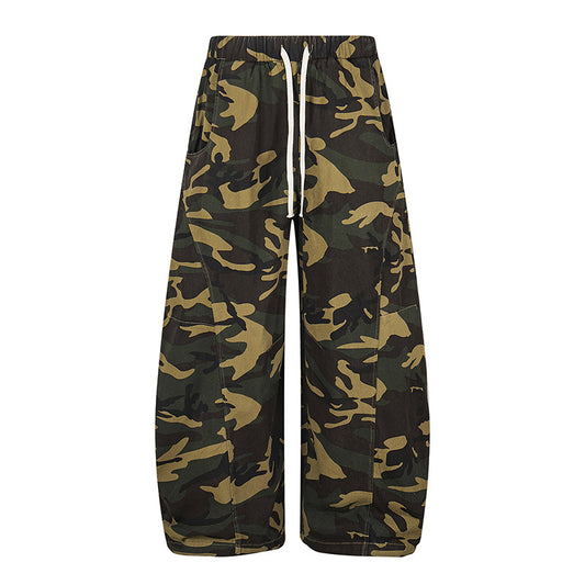 Woman wearing camouflage straight leg casual pants in an urban setting