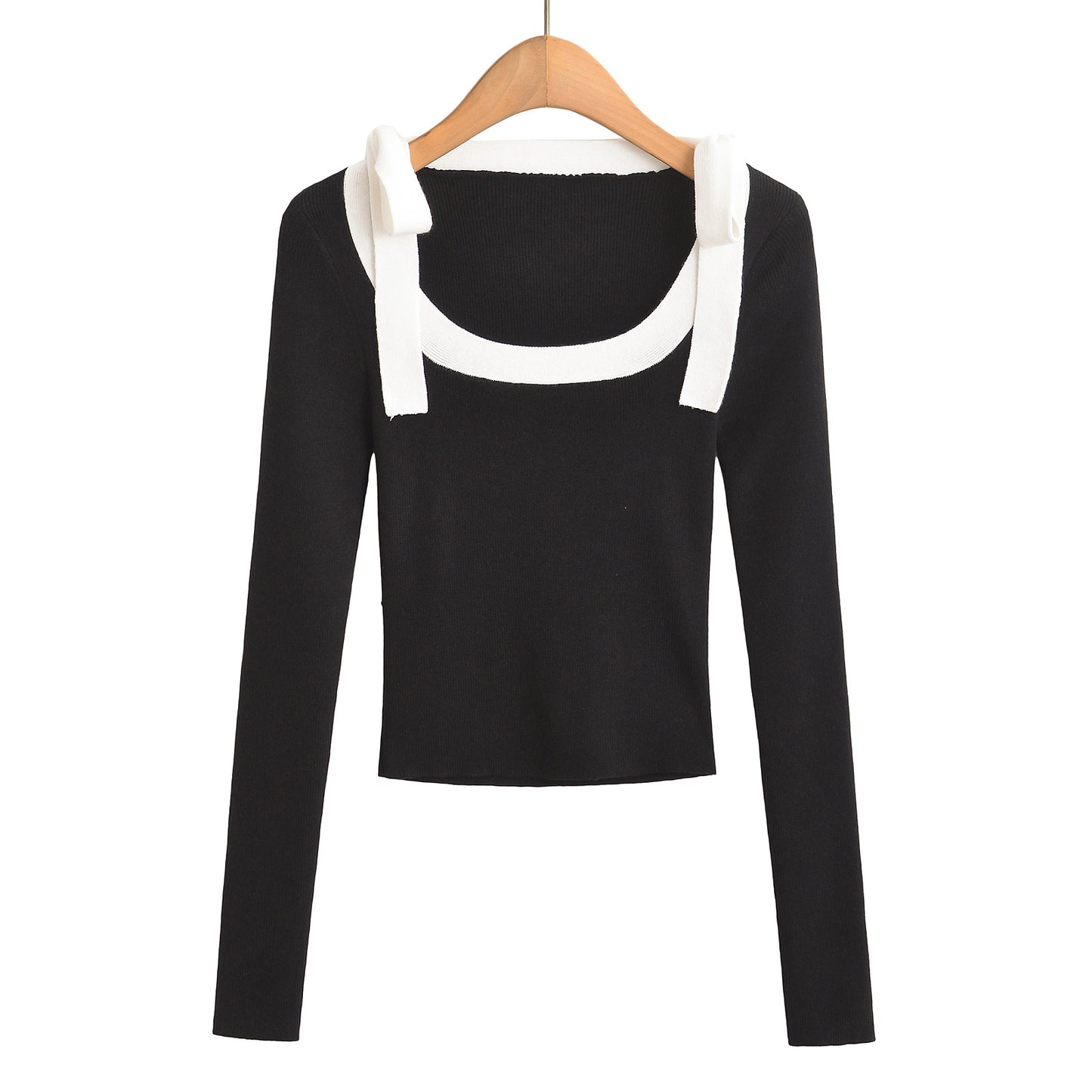 Woman wearing Square Neck Bow Ribbon Slim Fit Long Sleeve Sweater in a chic urban setting