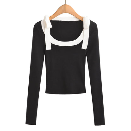 Woman wearing Square Neck Bow Ribbon Slim Fit Long Sleeve Sweater in a chic urban setting