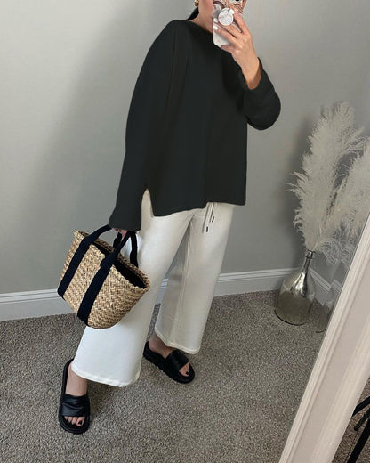 Woman wearing Loose Fit Long Sleeve Slit T-Shirt in a casual setting