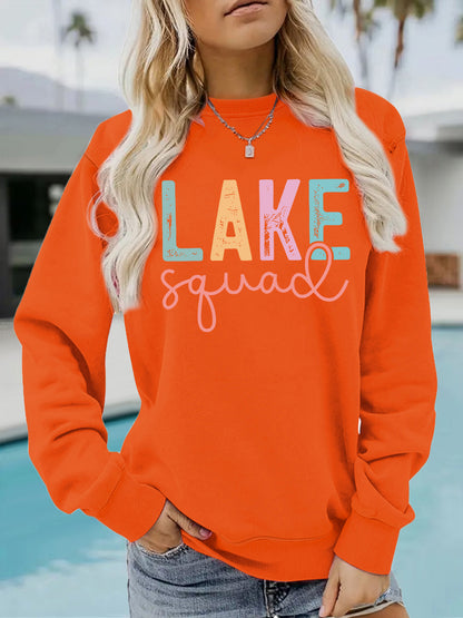 Woman wearing LAKE Printed Hoodie in a casual outdoor setting