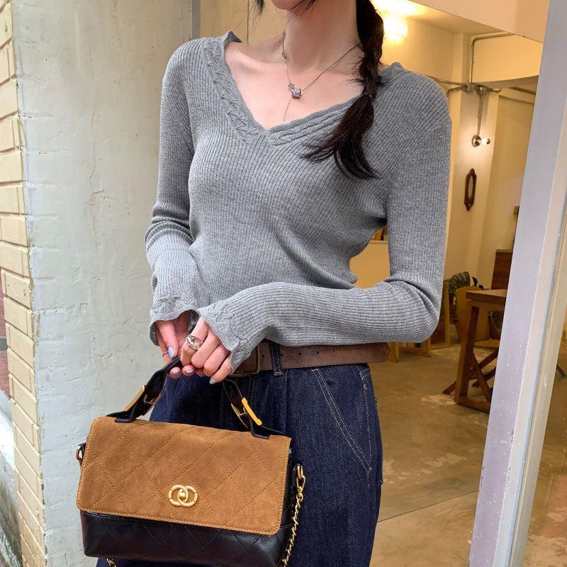 Woman wearing Slim Fit V-Neck Knit Top in a casual setting