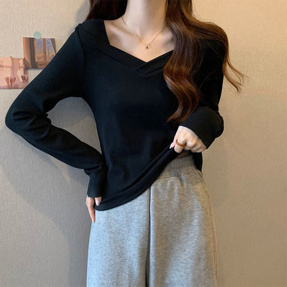 Woman wearing V Neck Long Sleeve Fleece Top in a casual setting