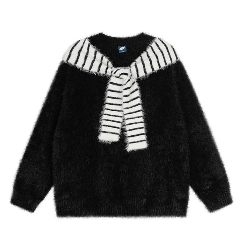 Woman wearing Oversized Loose Fit Poncho Knit Sweater in a cozy indoor setting