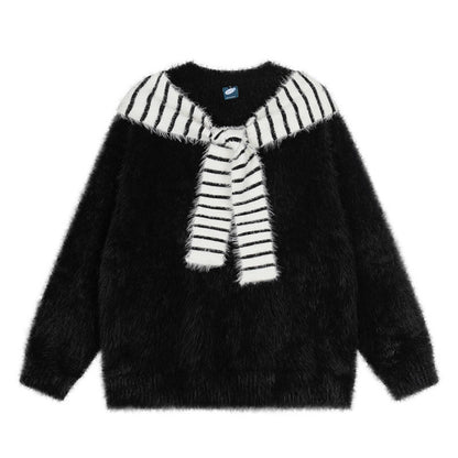 Woman wearing Oversized Loose Fit Poncho Knit Sweater in a cozy indoor setting