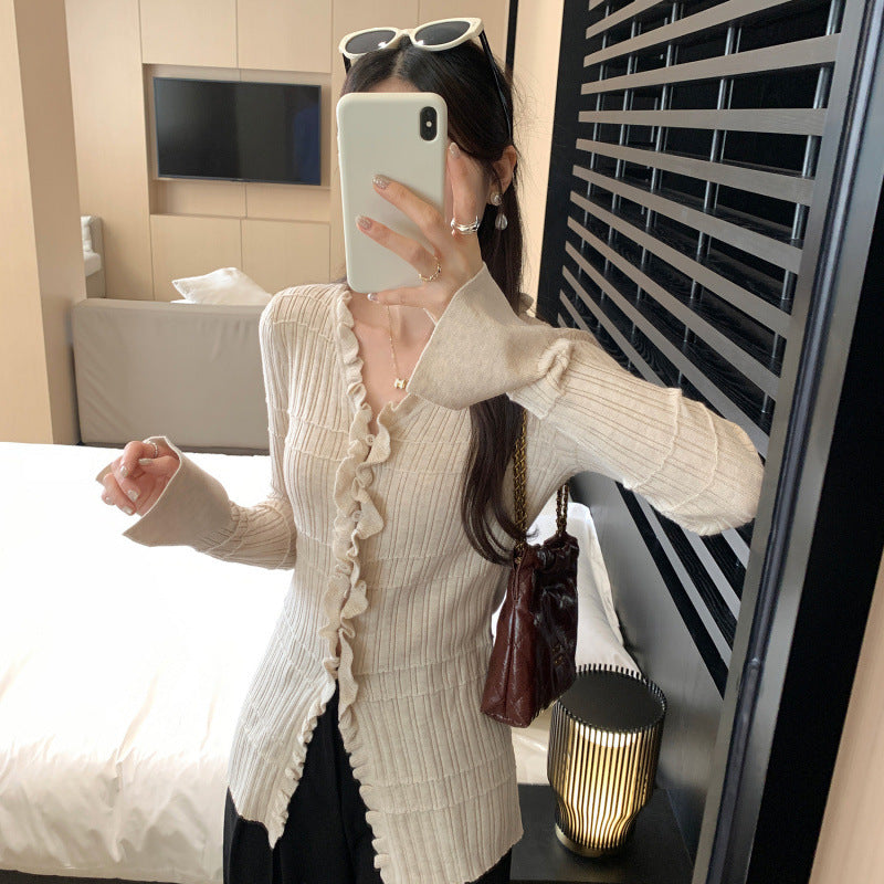 Woman wearing Ruffled V-Neck Slim Fit Cardigan in a stylish setting