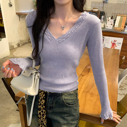 Woman wearing Slim Fit V-Neck Knit Top in a casual setting