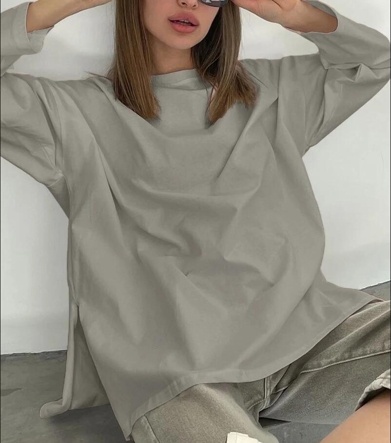 Woman wearing Loose Fit Long Sleeve Slit T-Shirt in a casual setting