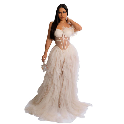 Woman wearing Sleeveless Bustier Mesh Maxi Dress in an elegant evening setting
