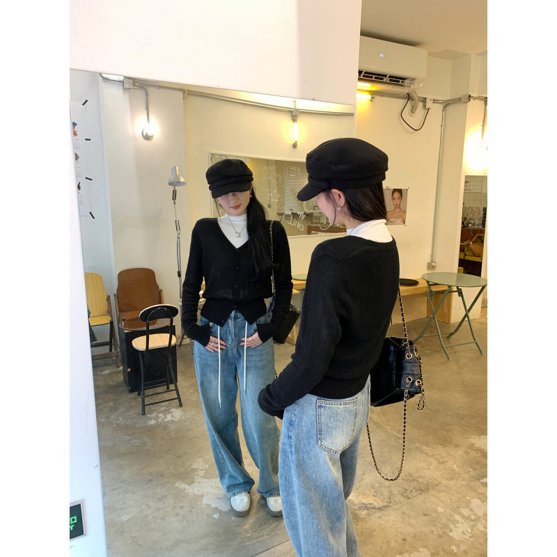 Woman wearing V-Neck Batwing Sleeve Knit Cardigan Coat in a stylish outdoor setting
