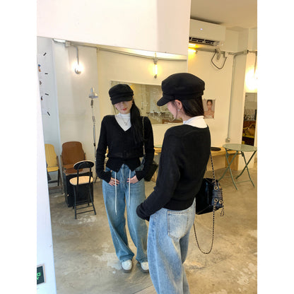 Woman wearing V-Neck Batwing Sleeve Knit Cardigan Coat in a stylish outdoor setting