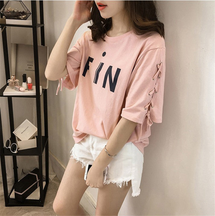 Woman wearing Letter Print Loose Fit T-Shirt in a casual setting