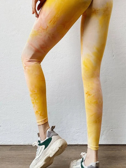 Woman wearing Tie-Dye High Waist Active Leggings in an active setting