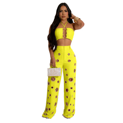 Woman wearing Flattering Ripped Fitted Two-Piece Nightclub Outfit in a vibrant nightclub setting