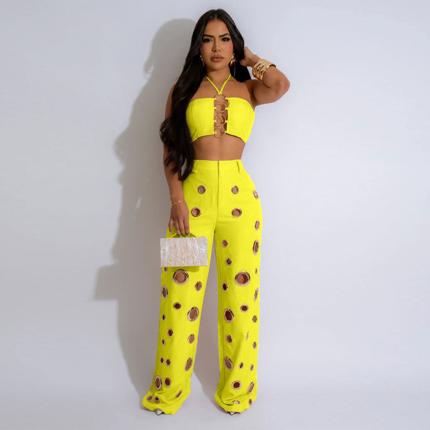 Woman wearing Flattering Ripped Fitted Two-Piece Nightclub Outfit in a vibrant nightclub setting