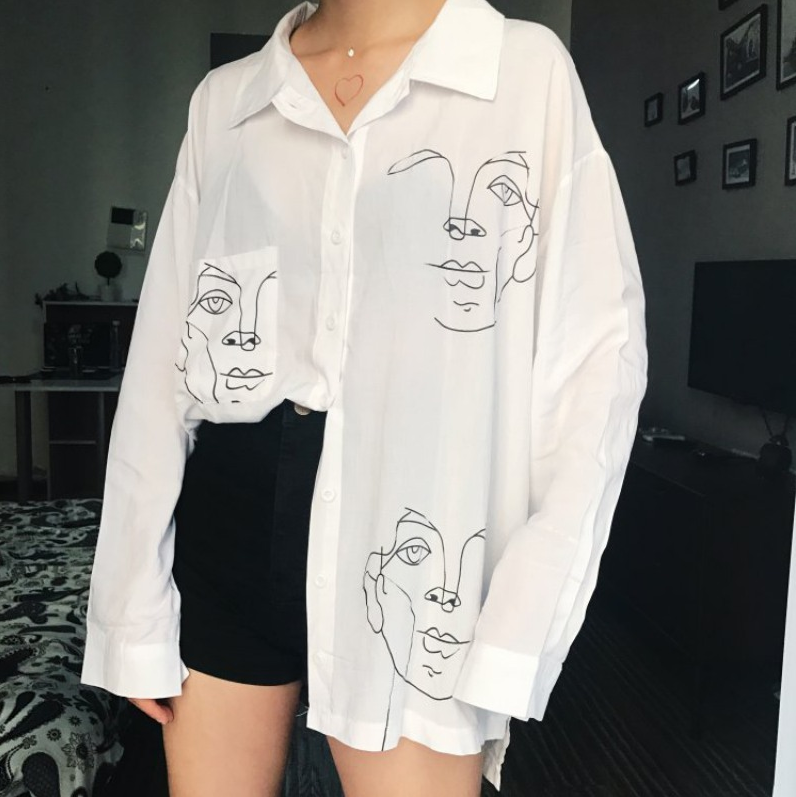 Woman wearing Cotton Face Print Blouse in a summer setting