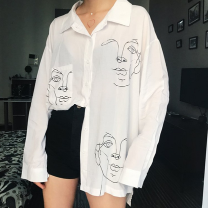 Woman wearing Cotton Face Print Blouse in a summer setting